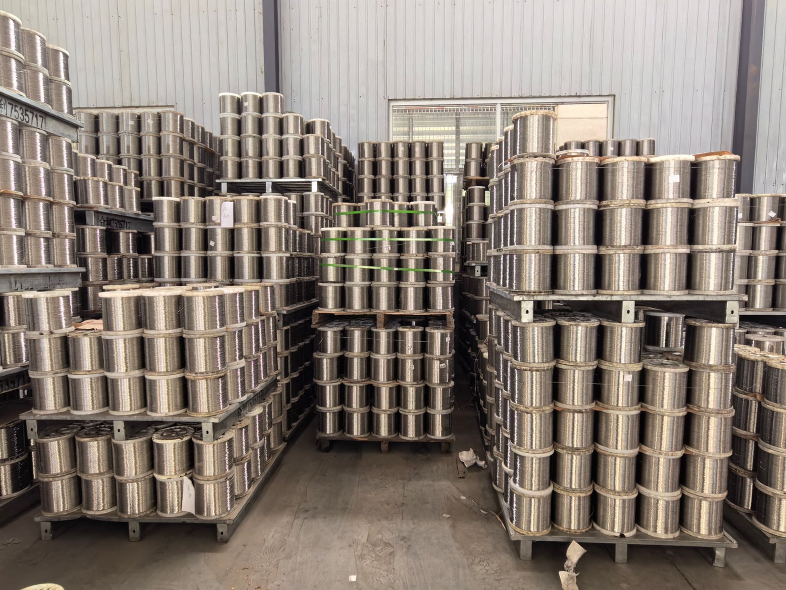 Stacks of raw metal billets ready for processing