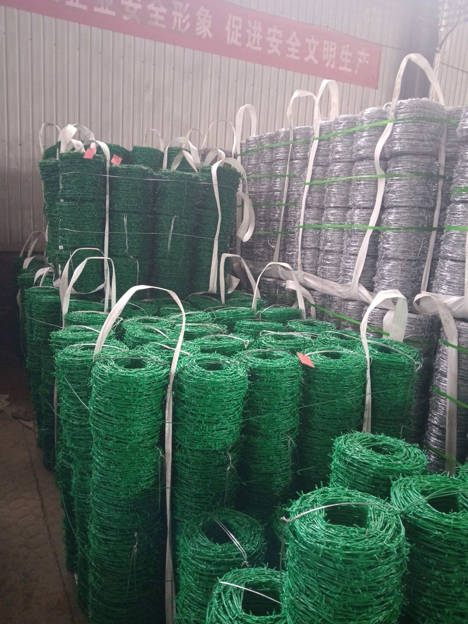 Razor wire and barbed wire coils for perimeter security at industrial facilities