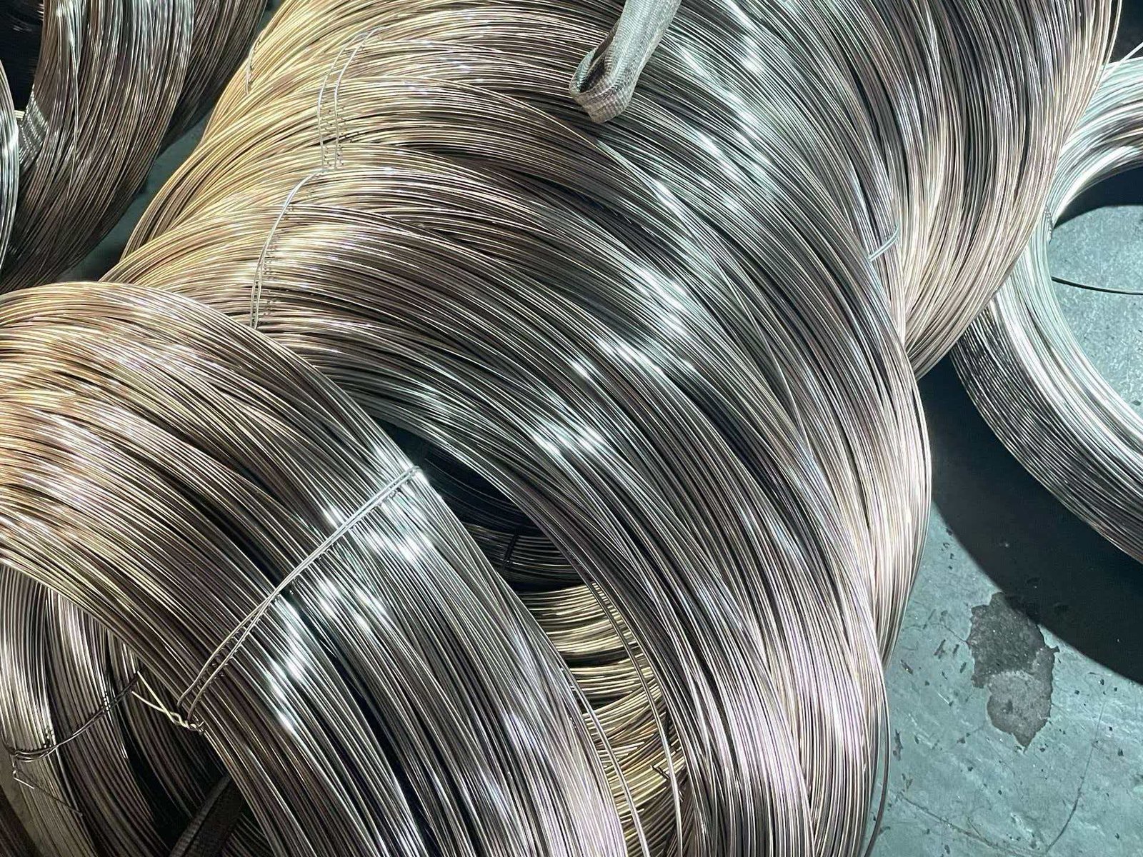 A coil of bright 201 stainless steel wire ready for shipment