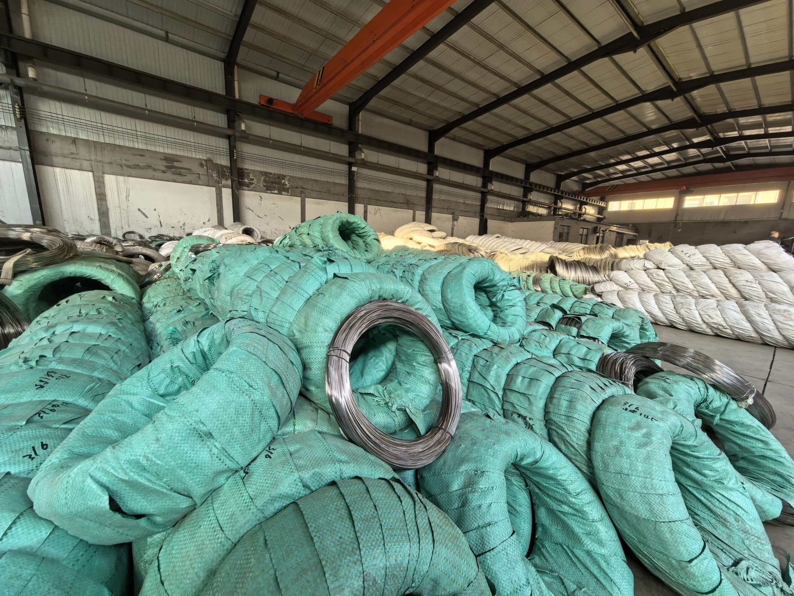 Large warehouse stocked with 201 stainless steel binding wire bulk coils